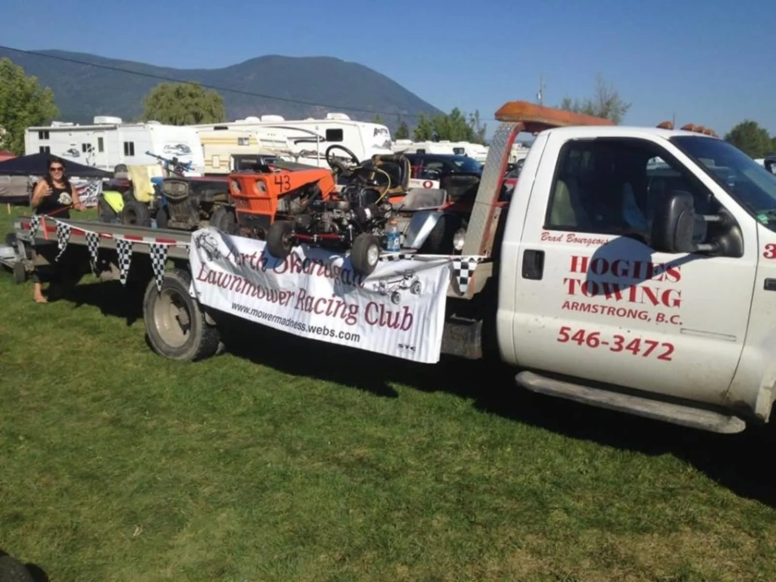 Hogie's flat deck truck loaded with racing lawnmowers for the North Okanagan Lawnmower Racing Club